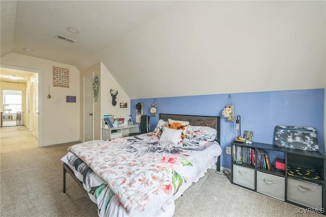 3706 Paul Karnes Dr, Hopewell, VA 23860 - carpeted bedroom with vaulted ceiling and baseboards