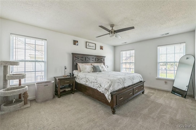 3706 Paul Karnes Dr, Hopewell, VA 23860 - bedroom featuring a textured ceiling, light carpet, and a ceiling fan
