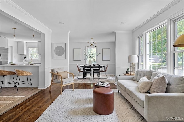 1908 Windsordale Dr, Henrico, VA 23229 - living room featuring healthy amount of natural light, wood finished floors, ornamental molding, a chandelier, and recessed lighting