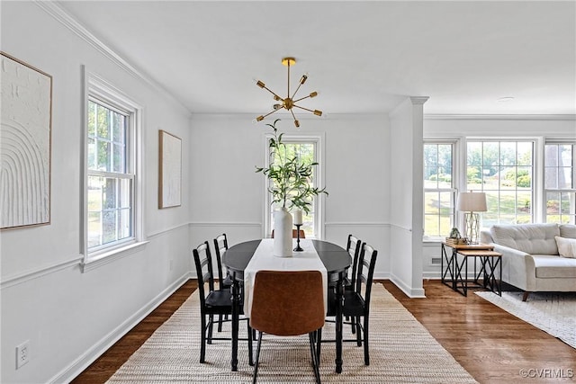 1908 Windsordale Dr, Henrico, VA 23229 - dining space with dark wood-type flooring, crown molding, and a chandelier