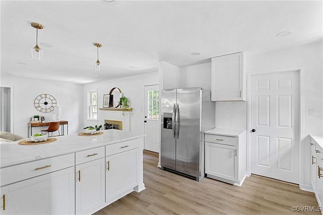 1908 Windsordale Dr, Henrico, VA 23229 - kitchen with stainless steel fridge with ice dispenser, light wood-style flooring, open floor plan, white cabinetry, and pendant lighting