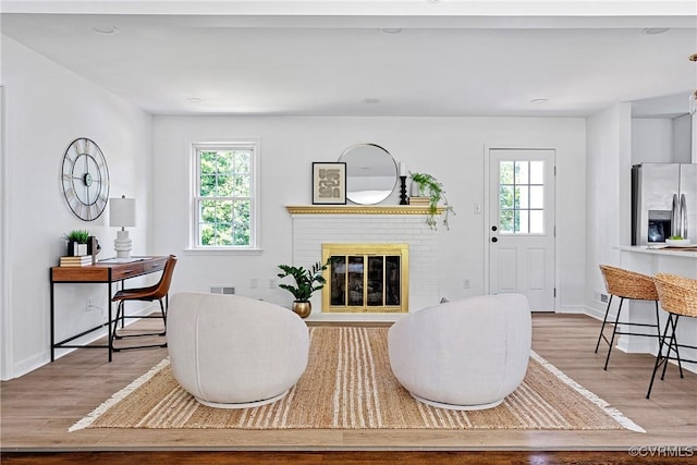 1908 Windsordale Dr, Henrico, VA 23229 - living area with wood finished floors and a brick fireplace