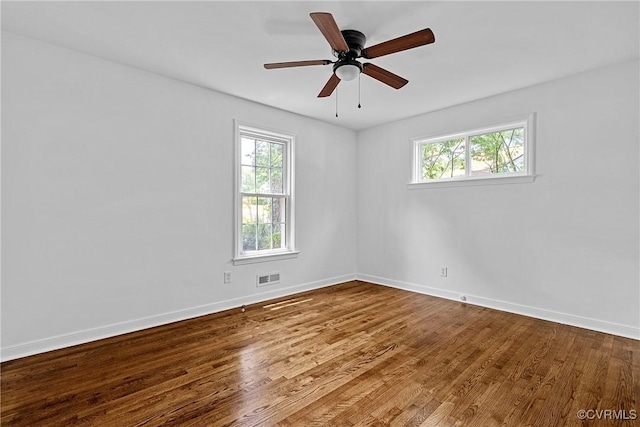 1908 Windsordale Dr, Henrico, VA 23229 - spare room with healthy amount of natural light, wood finished floors, and ceiling fan