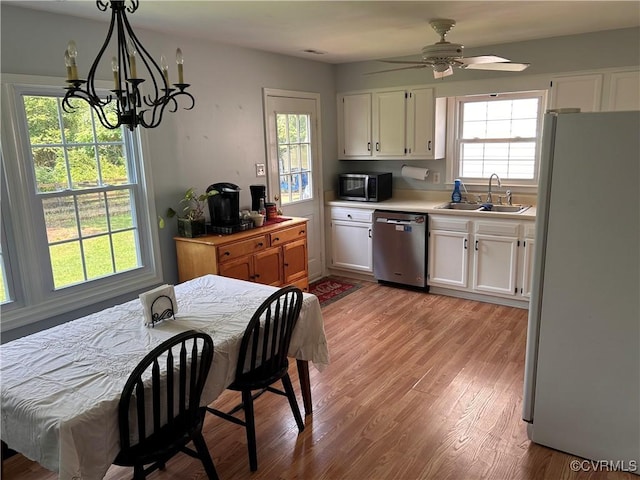 6033 Ironworks Ct, Mechanicsville, VA 23111 - kitchen with stainless steel appliances, white cabinets, and plenty of natural light