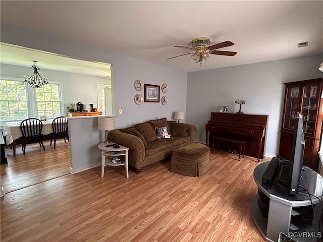6033 Ironworks Ct, Mechanicsville, VA 23111 - living area with a ceiling fan, light wood finished floors, and a chandelier