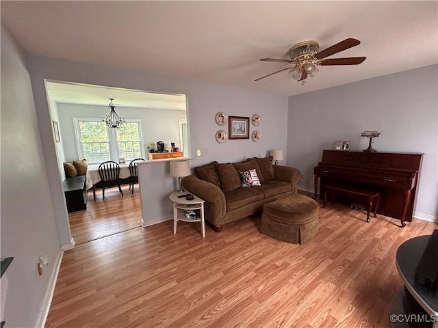 6033 Ironworks Ct, Mechanicsville, VA 23111 - living room with light wood-style floors, a ceiling fan, and a chandelier