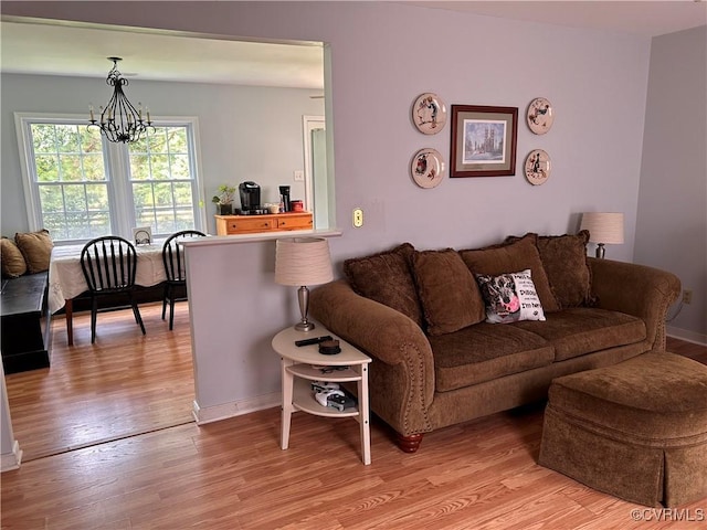 6033 Ironworks Ct, Mechanicsville, VA 23111 - living room with light wood-style flooring and a chandelier