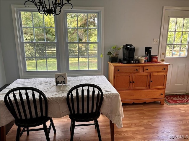 6033 Ironworks Ct, Mechanicsville, VA 23111 - dining space with a chandelier, plenty of natural light, and light wood-style floors