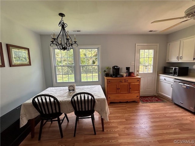 6033 Ironworks Ct, Mechanicsville, VA 23111 - dining area with light wood-style floors, a chandelier, and ceiling fan