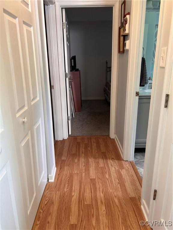 6033 Ironworks Ct, Mechanicsville, VA 23111 - hallway featuring light wood-style flooring and baseboards
