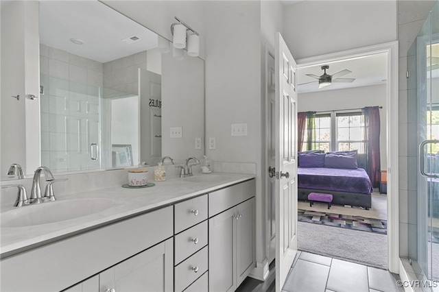 7001 Leire Ln, Chesterfield, VA 23832 - ensuite bathroom featuring ceiling fan, double vanity, a shower stall, and tile patterned floors