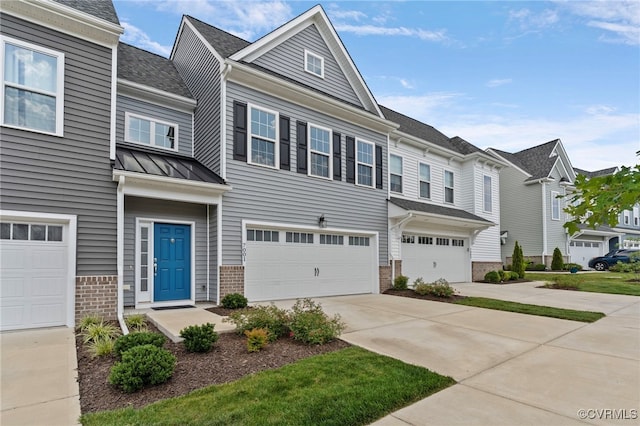 7001 Leire Ln, Chesterfield, VA 23832 - view of property featuring brick siding, a garage, driveway, a standing seam roof, and a residential view