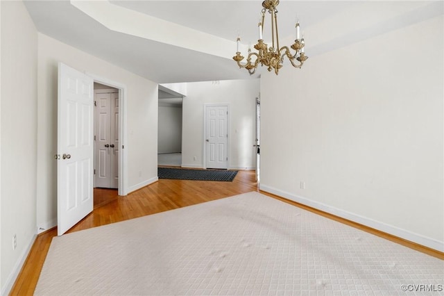 5908 Dominion Fairways Ct, Glen Allen, VA 23059 - spare room with wood finished floors and a chandelier