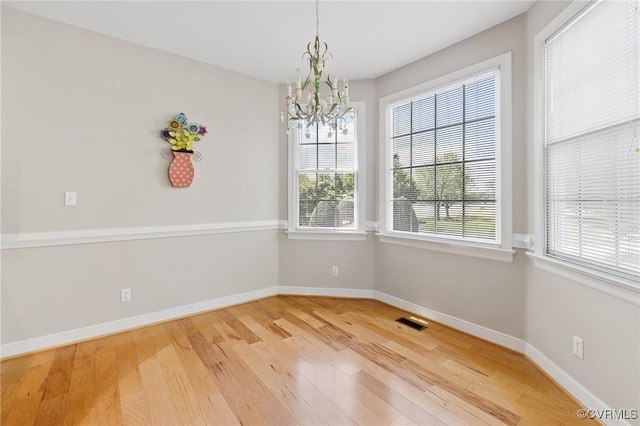 5908 Dominion Fairways Ct, Glen Allen, VA 23059 - unfurnished dining area with a chandelier, wood finished floors, and plenty of natural light