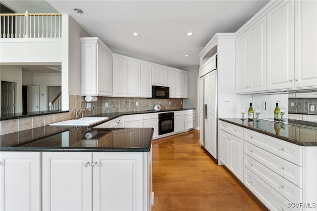 5908 Dominion Fairways Ct, Glen Allen, VA 23059 - kitchen featuring black appliances, white cabinets, tasteful backsplash, a peninsula, and recessed lighting