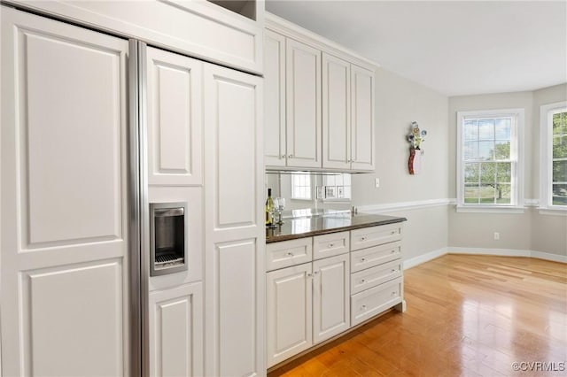 5908 Dominion Fairways Ct, Glen Allen, VA 23059 - kitchen featuring paneled built in refrigerator, light wood finished floors, and white cabinets