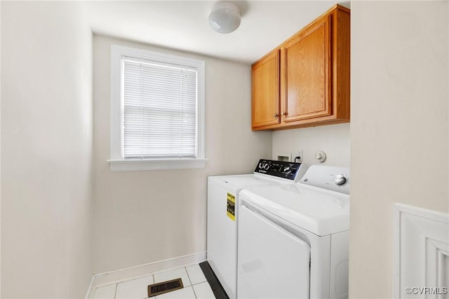5908 Dominion Fairways Ct, Glen Allen, VA 23059 - laundry room featuring washing machine and clothes dryer, tile patterned flooring, and cabinet space