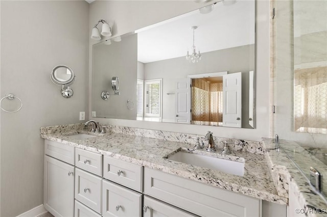 5908 Dominion Fairways Ct, Glen Allen, VA 23059 - full bathroom with double vanity and a chandelier
