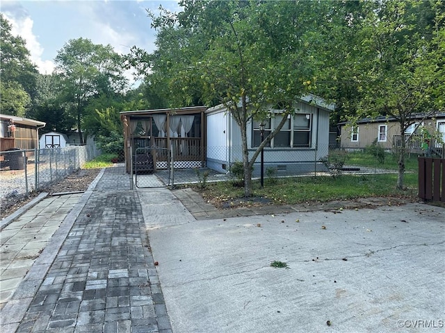 2305 Swift Bluff Dr, South Chesterfield, VA 23834 - view of front facade with crawl space and a shed