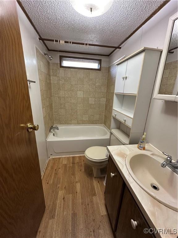 2305 Swift Bluff Dr, South Chesterfield, VA 23834 - bathroom with wood finished floors, vanity, a textured ceiling, and shower / bath combination