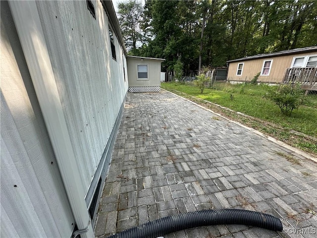 2305 Swift Bluff Dr, South Chesterfield, VA 23834 - view of patio featuring view of wooded area