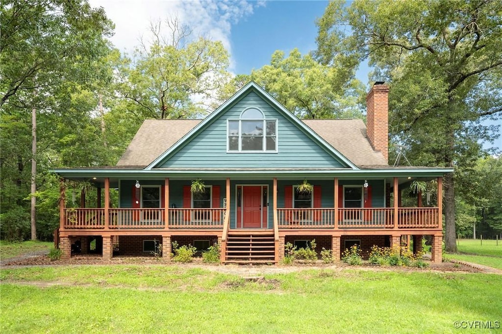 17067 Moores Mill Rd, Ruther Glen, VA 22546 - rear view of property featuring a porch, a yard, and a chimney