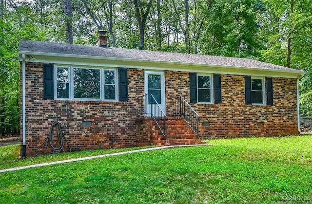 2131 Highland Dr, Powhatan, VA 23139 - ranch-style house featuring a front lawn, a chimney, and brick siding