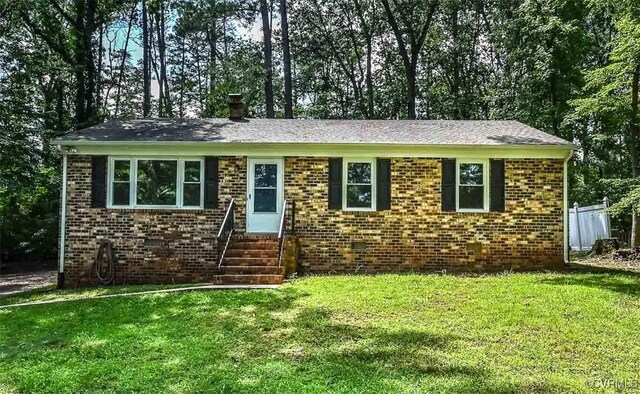 2131 Highland Dr, Powhatan, VA 23139 - view of front facade with entry steps, a front yard, and brick siding