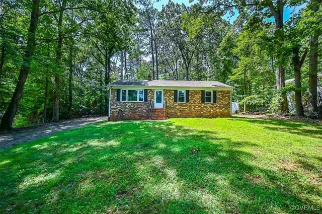 2131 Highland Dr, Powhatan, VA 23139 - view of front of house featuring a front yard and a chimney