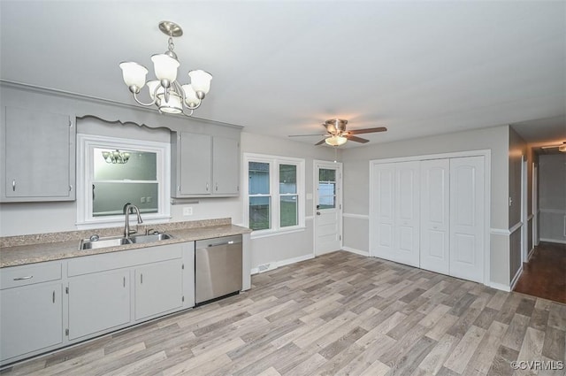 2131 Highland Dr, Powhatan, VA 23139 - kitchen with dishwasher, light countertops, light wood-style flooring, a ceiling fan, and a chandelier