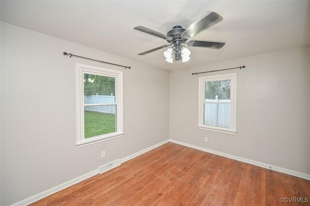 2131 Highland Dr, Powhatan, VA 23139 - unfurnished room featuring healthy amount of natural light, light wood-type flooring, and a ceiling fan