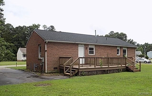 25504 Walkers Landing Ct, North Dinwiddie, VA 23803 - back of house featuring a deck, a yard, and brick siding