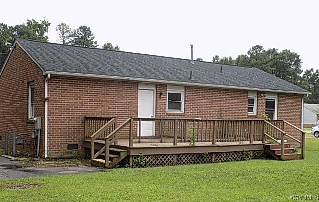 25504 Walkers Landing Ct, North Dinwiddie, VA 23803 - back of property featuring a deck, a yard, brick siding, and a shingled roof