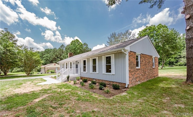 4300 N Courthouse Rd, Providence Forge, VA 23140 - view of front of property featuring a front lawn, crawl space, board and batten siding, a chimney, and a shingled roof