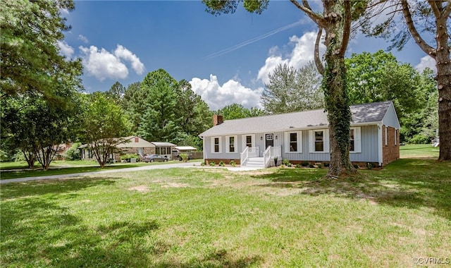 4300 N Courthouse Rd, Providence Forge, VA 23140 - single story home featuring a chimney, board and batten siding, a front yard, and a shingled roof