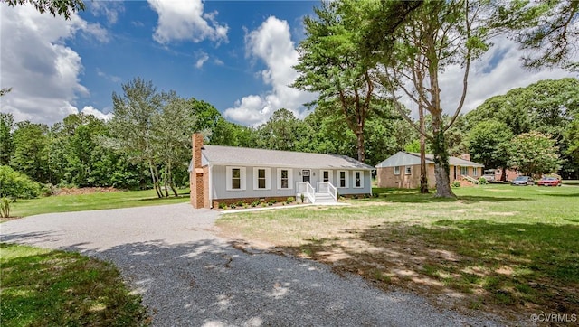 4300 N Courthouse Rd, Providence Forge, VA 23140 - single story home with gravel driveway, a chimney, and a front yard
