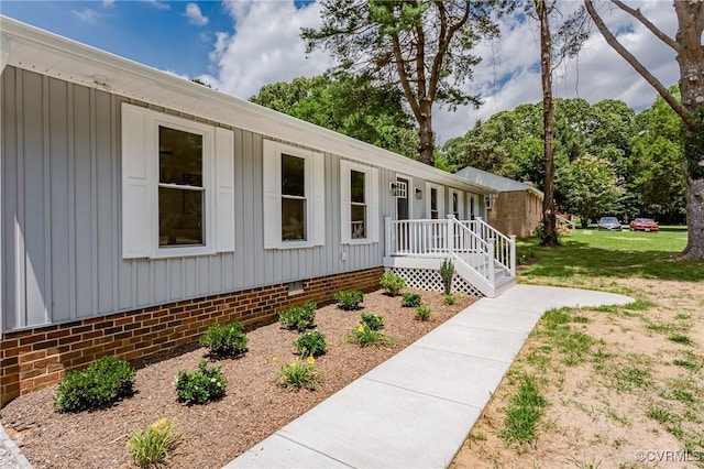4300 N Courthouse Rd, Providence Forge, VA 23140 - view of front facade with board and batten siding and crawl space