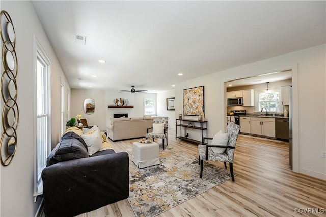 4300 N Courthouse Rd, Providence Forge, VA 23140 - living area with light wood-type flooring, a ceiling fan, recessed lighting, and a fireplace