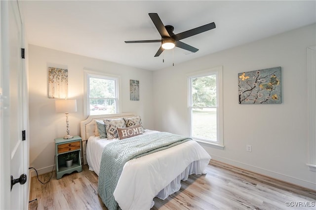 4300 N Courthouse Rd, Providence Forge, VA 23140 - bedroom featuring multiple windows, light wood-style floors, and a ceiling fan