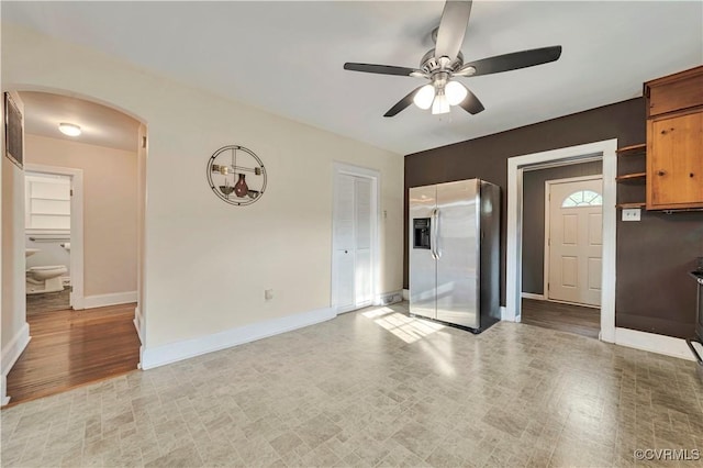 4305 Lakeview Rd, South Chesterfield, VA 23803 - unfurnished living room with arched walkways and a ceiling fan