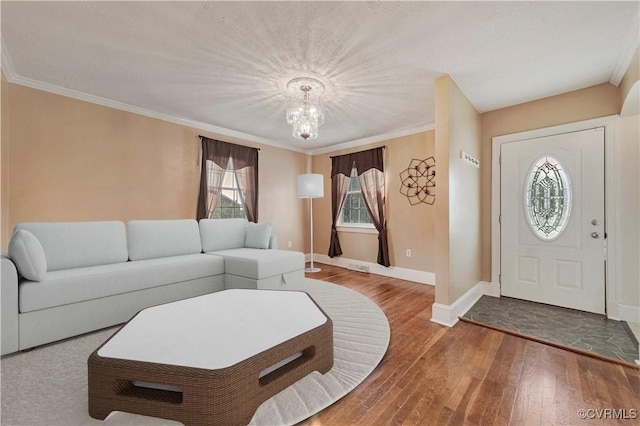 4305 Lakeview Rd, South Chesterfield, VA 23803 - living area featuring a chandelier, wood finished floors, and crown molding