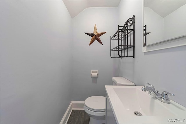 4305 Lakeview Rd, South Chesterfield, VA 23803 - half bathroom featuring wood finished floors, vaulted ceiling, and vanity
