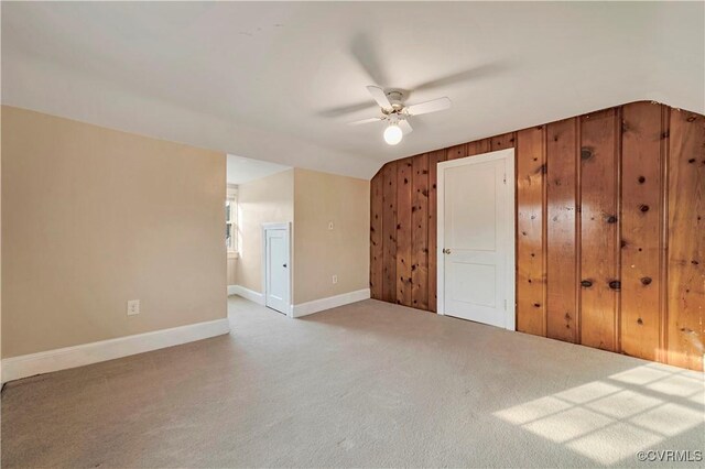 4305 Lakeview Rd, South Chesterfield, VA 23803 - unfurnished bedroom with carpet, wooden walls, lofted ceiling, and a ceiling fan