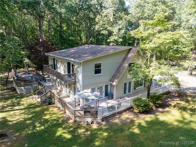 844 Rocky Point Lndg, Cobbs Creek, VA 23035 - back of house with roof with shingles, a yard, french doors, and a deck