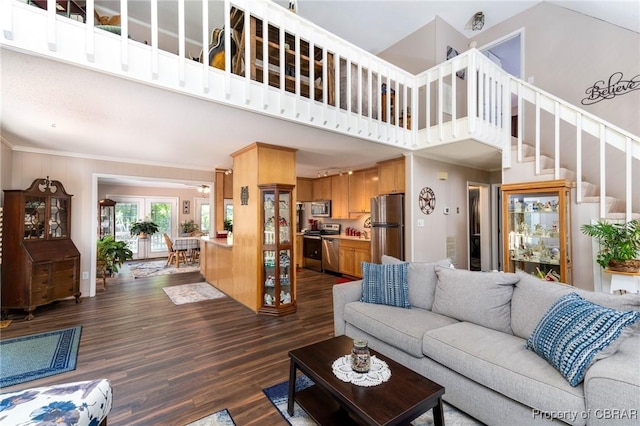 844 Rocky Point Lndg, Cobbs Creek, VA 23035 - living area featuring dark wood finished floors, a towering ceiling, stairs, and ornamental molding