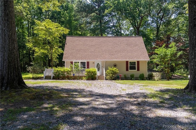 844 Rocky Point Lndg, Cobbs Creek, VA 23035 - cape cod house with driveway, a wooden deck, and roof with shingles