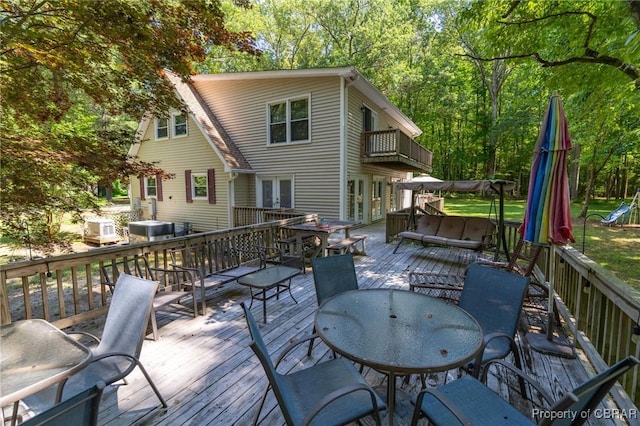 844 Rocky Point Lndg, Cobbs Creek, VA 23035 - wooden terrace featuring a hot tub and outdoor dining area