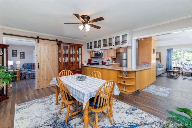 844 Rocky Point Lndg, Cobbs Creek, VA 23035 - dining area featuring a barn door, a ceiling fan, crown molding, and dark wood-type flooring