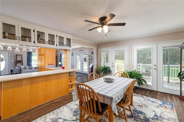 844 Rocky Point Lndg, Cobbs Creek, VA 23035 - dining area featuring french doors, dark wood-style floors, ceiling fan, a textured ceiling, and crown molding
