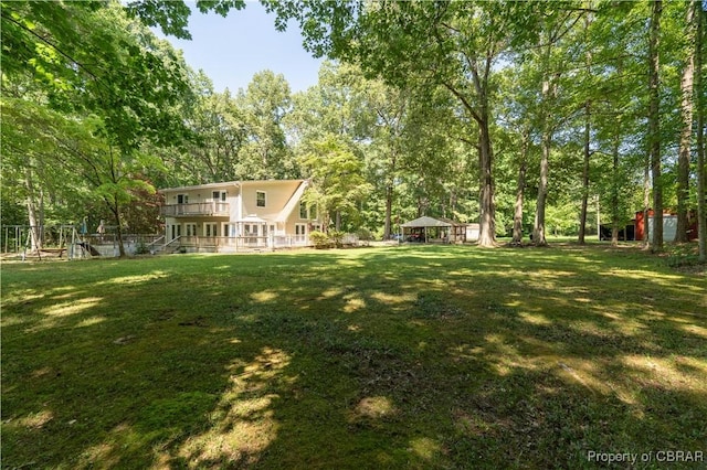 844 Rocky Point Lndg, Cobbs Creek, VA 23035 - view of grassy yard featuring a gazebo and view of wooded area